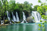 Fototapeta Kwiaty - View at beautiful Kravice waterfalls
