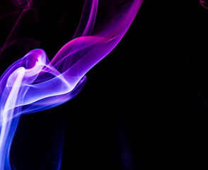 Colored smoke on black background