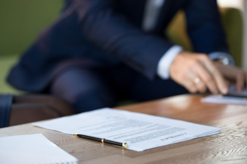 Poster - Close up of business contract on table with pen