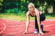 © bobex73 - Athlete woman in starting run position. Sport, fitness, athletics concept