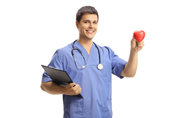 Young male doctor holding a small red heart