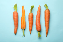 Flat Lay Composition With Fresh Carrots On Color Background