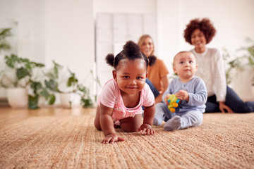 Wall Mural - Two Mothers Meeting For Play Date With Babies At Home In Loft Apartment