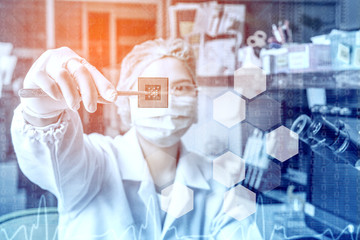 Technician in glasses is analyzing the CPU, repair computer in service center.