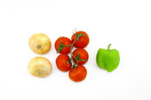 White Background. Top View Of Fresh Vegetables - Onions, Tomatoes On A Branch And Green Pepper