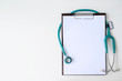 © NAMPIX - Blank medical clipboard with stethoscope on white background.