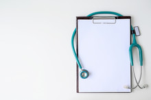 Blank Medical Clipboard With Stethoscope On White Background.