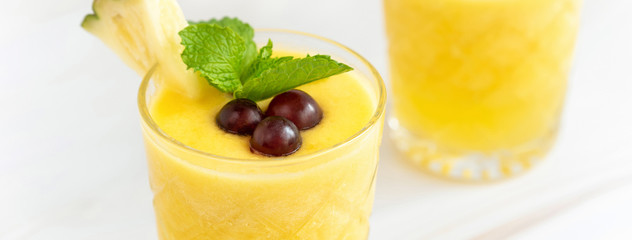 Wall Mural - Refreshing pineapple summer drink on marble table