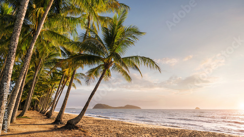 Cuadros en Lienzo Panoramic view of an empty tropical beach at the sunrise with copy space