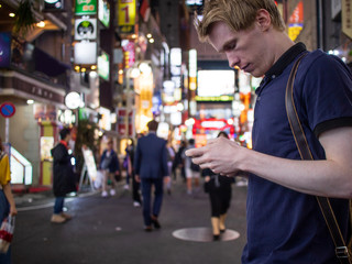 A handsome man looking at his phone