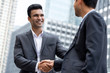 © Atstock Productions - Young smiling Indian businessman making handshake with partner