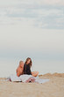 © Мария Бучнева - a couple in love a man and a girl meet the dawn in bed on the beach