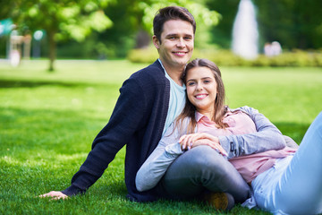 Wall Mural - Young couple strolling in the park