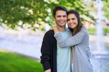 Wall Mural - Young couple strolling in the park