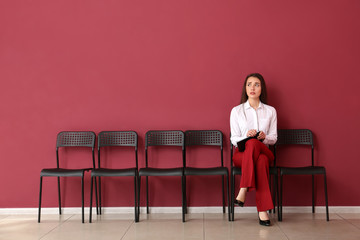 Wall Mural - Young woman waiting for job interview indoors