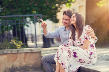 Wall Mural - Young couple dating in the park