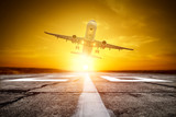 Fototapeta Storczyk - Summer travel time of airplane on airport and free space for your decoration. Summer sunset time. 