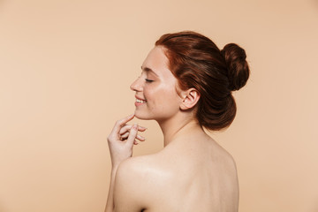 Wall Mural - beauty portrait of an attractive young topless redhead woman