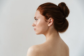 Wall Mural - beauty portrait of an attractive young topless redhead woman