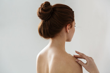 Wall Mural - beauty portrait of an attractive young topless redhead woman