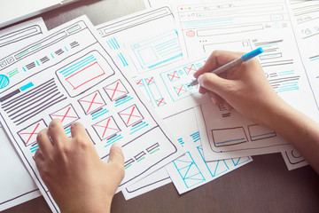 Website designer Creative planning application developer development draft sketch drawing template layout prototype framework wireframe design studio . User experience concept .