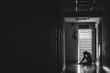 © TeTe Song - Silhouette of girl sitting alone in the dark,Sad and Serious women sitting hug his knee alone of old condo, Domestic violence, family problems, Stress, violence, with copy space