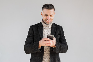 Canvas Print - Attractive man wearing coat standing