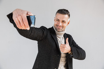 Poster - Attractive man wearing coat standing