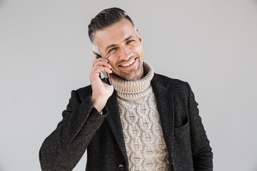 Canvas Print - Attractive man wearing coat standing