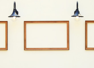 Wooden frame on the wall with lamp