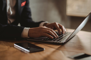 Businessman working on laptop in office