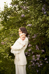 Mother and daughter in blossoming park