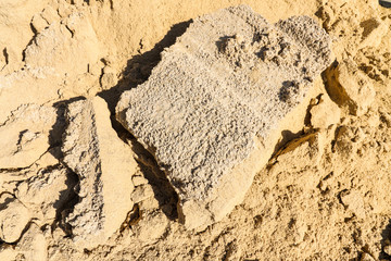 Close up Lumps of hard sand Caused by evaporation of water from the sand. That break apart.