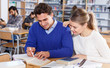 © JackF - Young people preparing for exam in library