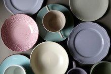 Collection Of Pottery And Kitchenware In Muted Pastel Colors. Top View.