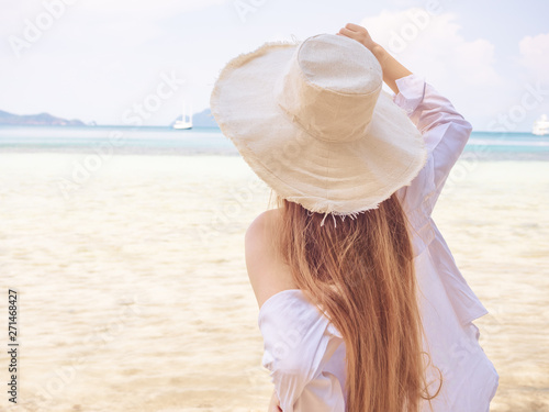 Summer Leisure Concept From Backside Of Beautiful Carefree Woman