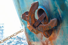 Ship Anchor In Up Position. Heavy Metal Anchor On The Side Of The Ship.