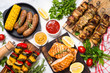 Barbeque dish - Grilled meat, fish, sausages and vegetables. 