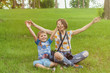 © Konstiantyn Zap - Mother and son on a green meadow in summer. Rest of the child and the parent on the nature.