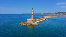 Aerial Drone Panoramic View Of Iconic And Picturesque Venetian Old Port Of Chania With Famous Landmark Lighthouse And Traditional Character, Crete Island, Greece
