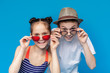© Prostock-studio - Cute friendly kids in summer wear looking over sugnlasses