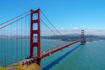 Famous Golden Gate Bridge. Suspension bridge spanning the Golden Gate. The structure links the American city of San Francisco, California – the northern tip of the San Francisco Peninsula – to Marin C