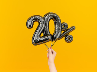 Wall Mural - Twenty percent symbol discount. 20 % sale banner black flying foil balloons on yellow. 3d rendering.