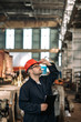 © bnenin - Quality control worker at train repair station.