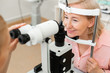 Senior good-looking woman visiting ophthalmologist and checking her eyesight