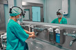© Georgii - Surgical hand disinfection.The doctor washes his hands, disinfect their hands before surgery.