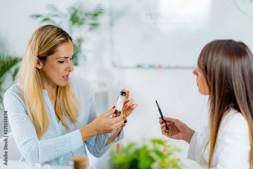 Homeopathy. Woman visiting a homeopath - obrazy, fototapety, plakaty 