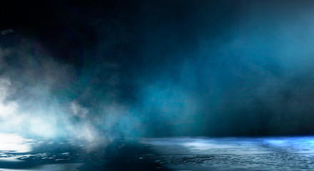 Wet asphalt, reflection of neon lights, a searchlight, smoke. Abstract light in a dark empty street with smoke, smog. Dark background scene of empty street, night view, night city.