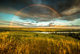 Fototapeta Tęcza -  Rainbow over the Moloma River. Russia. Kirov region