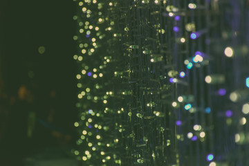 De focused/blur image of light at night.Bokeh lighting of the Christmas tree.light in the night